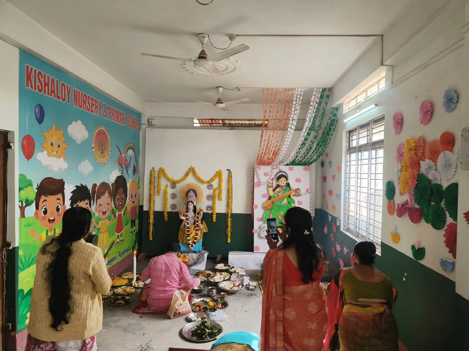 Students and teachers during Saraswati Puja
