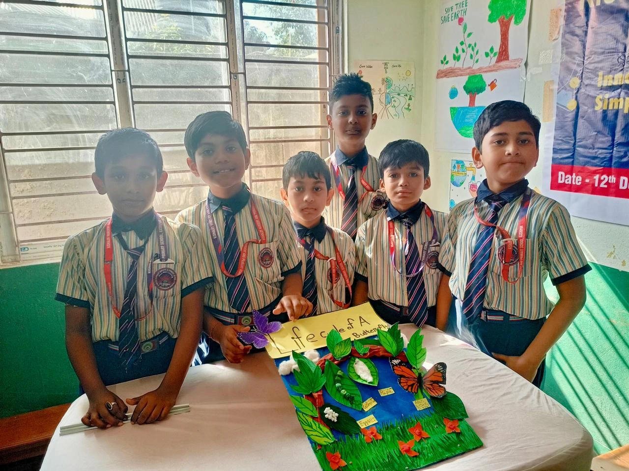 Students presenting a classroom project at Kishaloy Global School