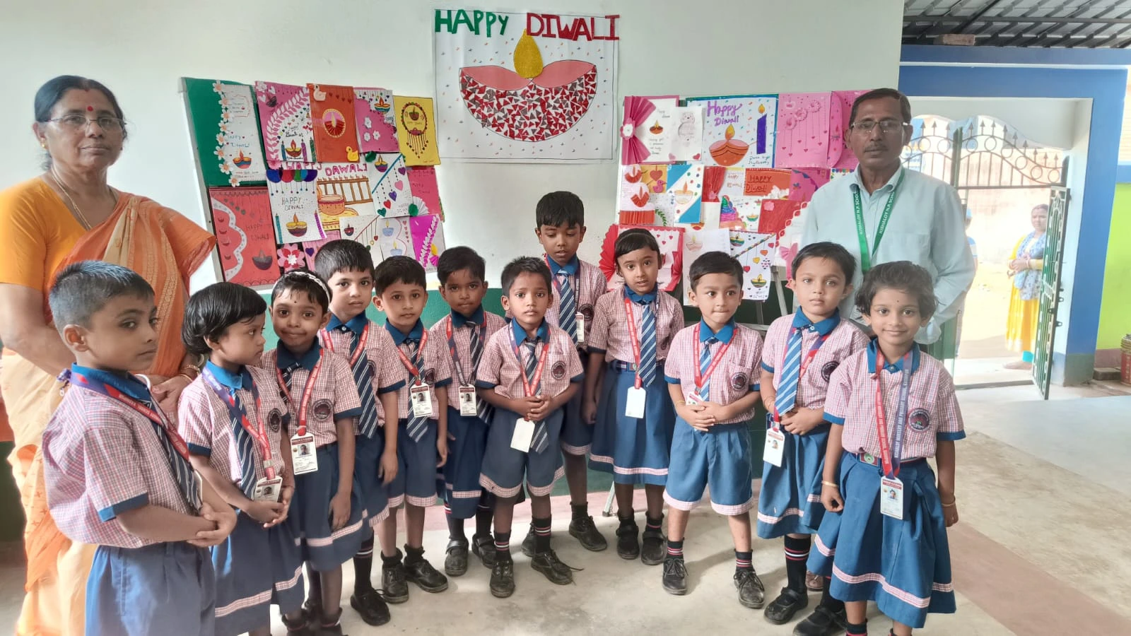 Students with Diwali art and craft display