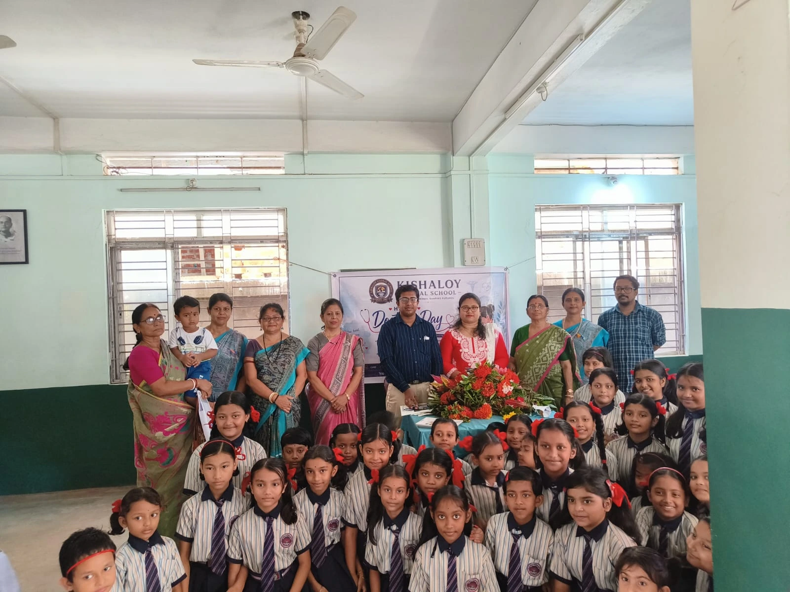 Young learners with teachers at Kishaloy Global School